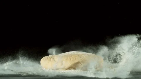 Super slow motion of falling yeast dough into flour. Stock Footage 131891123