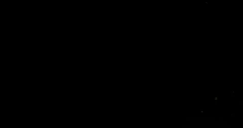 Super slow motion fine dust particles floating in the air on a black background Vidéo 335086606