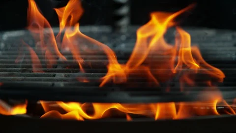 Super slow motion of flames with empty grill grid. Stock Footage 128835814