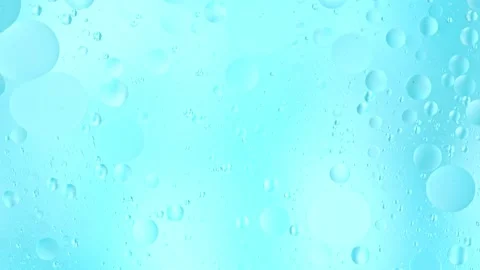 Super slow motion of flowing oil bubbles in water. Stock Footage 252133952