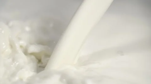 Super Slow Motion Flowing Stream Of Milk Settles Into Thick White Reservoir Stock Footage 325080600