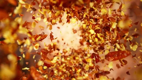 Super slow motion of flying and rotating dry chilli peppers. Stock Footage 262623434