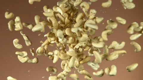 Super slow motion of flying cashews nuts collision Stock Footage 132255237