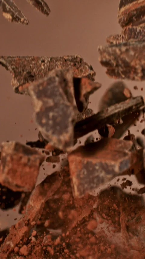 Super Slow Motion of Flying Chocolate Chunks up in the Air. Stock Footage 295028369