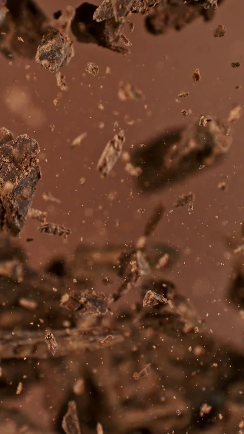 Super Slow Motion of Flying Chocolate Chunks up in the Air. Stock Footage 295028382