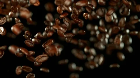 Super slow motion of flying coffee beans. Stock Footage 114565168