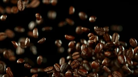 Super slow motion of flying coffee beans. Free Stock Footage 114565636