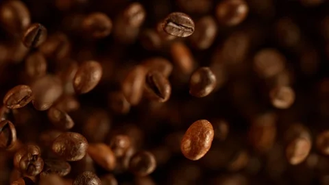 Super slow motion of flying coffee beans. Stock Footage 120693255