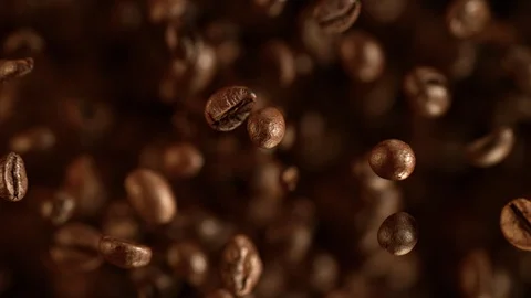 Super slow motion of flying coffee beans. Stock Footage 120694262