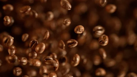 Super slow motion of flying coffee beans. Stock Footage 121263780
