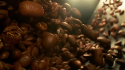 Super slow motion of flying coffee beans, rotating in tunnel Stock Footage 150125898