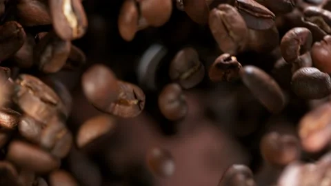 Super slow motion of flying coffee beans, macro shot. Stock Footage 150127277