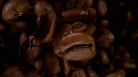 Super slow motion of flying coffee beans in speed ramping. Stock Footage 157607496
