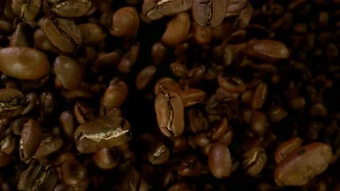 Super slow motion of flying coffee beans in speed ramping. Stock Footage 157607697