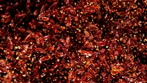 Super slow motion of flying dry red hot chilli peppers. Stock Footage 252134107