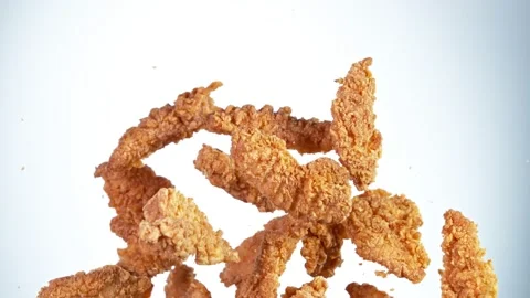Super slow motion of flying fried chicken stripes on white background Stock Footage 161349151