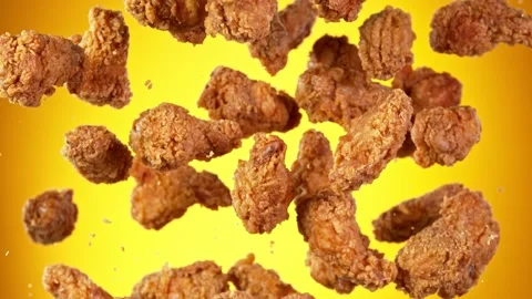 Super slow motion of flying fried chicken wings on golden background Stock Footage 161352083