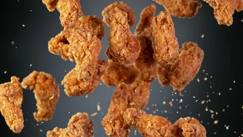 Super slow motion of flying fried chicken wings on black background Video stock 161354298