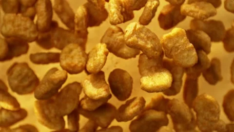 Super slow motion of flying fried chicken stripes on golden background Stock Footage 262557585