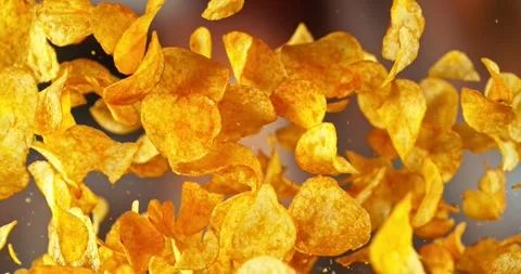 Super Slow Motion of Flying Fried Pepper Potatoes Chips. Stock Footage 293578444