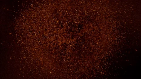 Super slow motion of flying ground coffee, speed ramp effect. Stock Footage 152767221