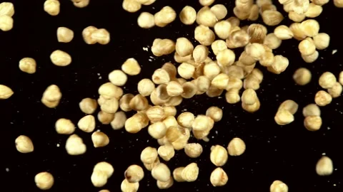 Super slow motion of flying hazelnuts collision Stock Footage 132253181