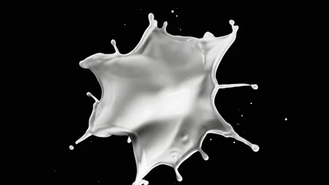 Super slow motion of flying milk splash on black background. Video stock 234639569