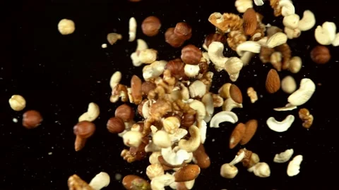 Super slow motion of flying mix nuts collision Stock Footage 132253345