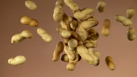 Super slow motion of flying peanut collision Stock Footage 132255629