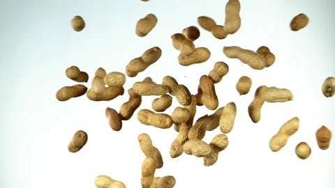 Super slow motion of flying peanut collision Stock Footage 132255722