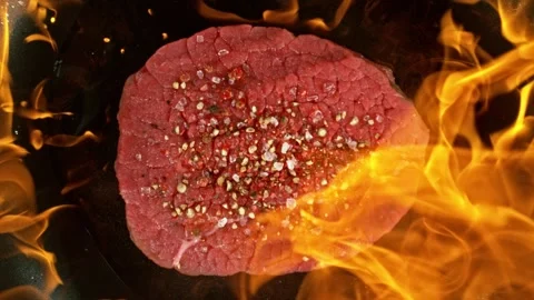 Super Slow Motion of Flying Raw Beef Steak on Pan with Fire. Stock Footage 290425964