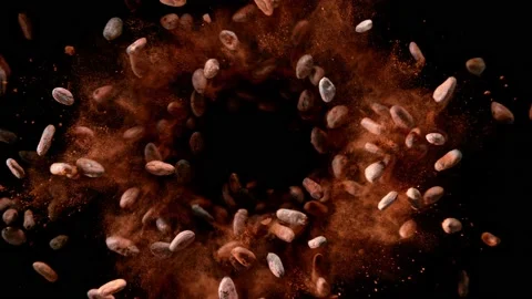 Super slow motion of flying roasted cocoa beans in rotation movement Stock Footage 167238275