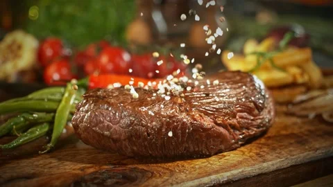 Super Slow Motion of Flying Salt no Beef Steak. Stock Footage 266996990