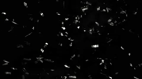 Super slow motion of flying silver confetti isolated on black background. Stock Footage 162033926