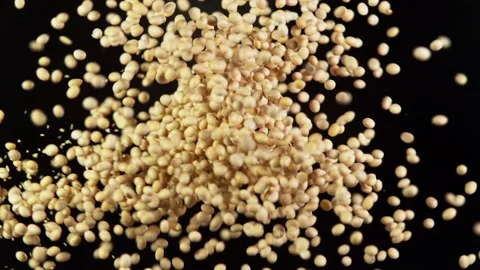 Super slow motion of flying soya pieces up in the air. Stock Footage 139810661
