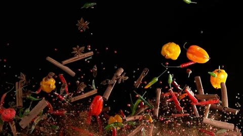 Super slow motion of flying spices mix on black background Video stock 165928203