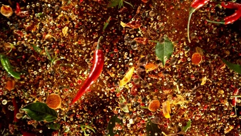 Super slow motion of flying spices mix with chilli peppers. Stock Footage 282439945
