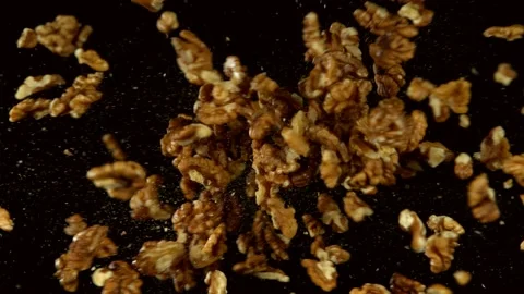 Super slow motion of flying walnut collision Stock Footage 132254896