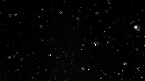 Super Slow Motion of Flying Water Drops, Isolated on Black Background. Stock Footage 296368537