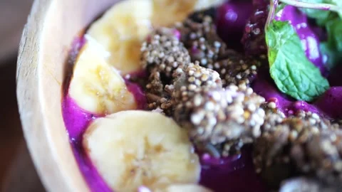 Super slow-motion footage from left to right of an acai bowl Stock Footage 281615722