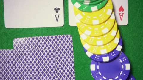 Super slow motion the game pieces fall down on the cards Stock Footage 72340704