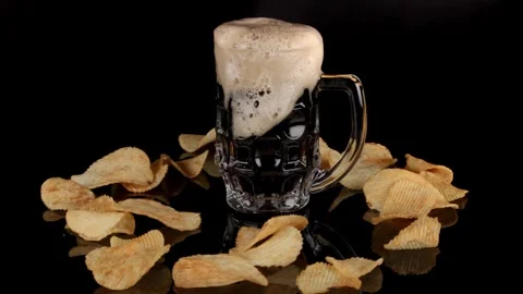 Super slow motion a glass of cold beer on a table in a black background Stock Footage 288979922