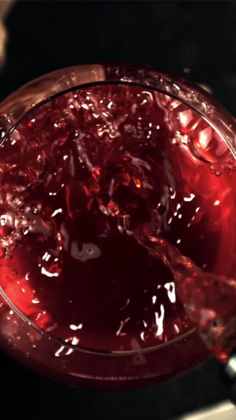 Super slow motion in the glass pour red wine. Filmed on a high-speed camera at Stock Footage 335286514