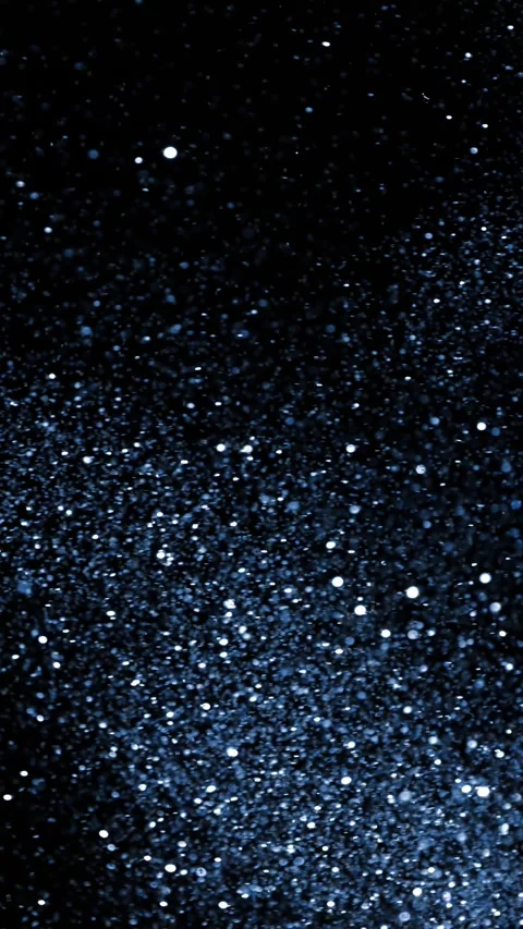 Super Slow Motion of Glittering Blue Particles Isolated on Black Background. Stock Footage 296149989
