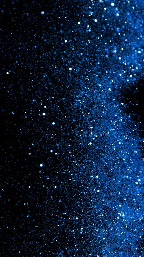 Super Slow Motion of Glittering Blue Particles Isolated on Black Background. Stock Footage 296150129