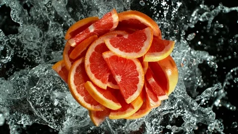 Super slow motion of grapefruit with water splash. Stock Footage 224493926