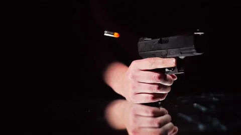 Super slow motion gun cocked bullet shell flies out Video stock 152916271