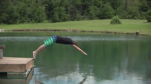 Super Slow Motion - Guy Jumps in Pond Stock Footage 26761496