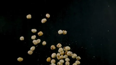 Super Slow Motion Hazelnut Flying Towards Camera on Black Background at 1000fps. Stock Footage 281716370