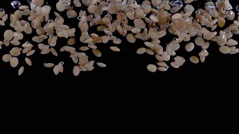 Super slow motion, a heap of green lentils fall into the water Stock Footage 196664228